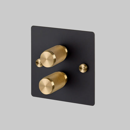 2G Dimmer/ 100W/ Black with brass details, angled view.